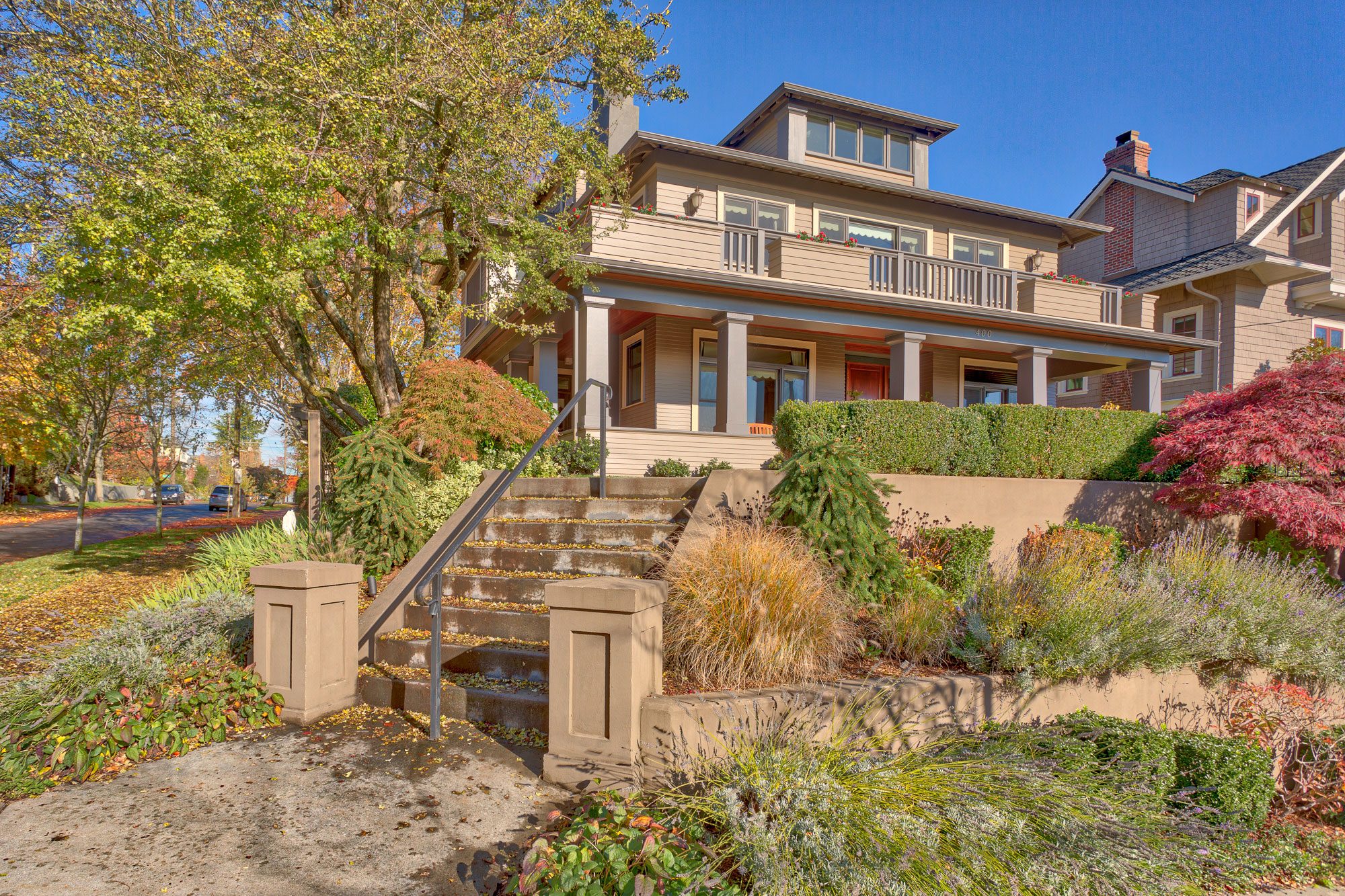 A distant view of a large house's exterior completed by Exterior Crew, LLC in Seattle, WA